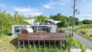 A modern house with a wooden deck and large windows. - AKESUKE (Minamiawaji)