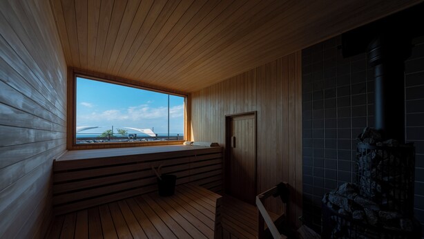 A sauna room with wooden walls and a large window overlooking a snowy landscape. - AKESUKE (Minamiawaji)