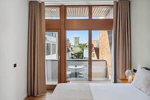 Comfort Suite with Balcony | 1 bedroom, individually decorated, individually furnished, desk