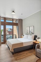 Comfort Suite with Balcony | 1 bedroom, individually decorated, individually furnished, desk