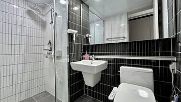 Shower, hair dryer, towels, soap