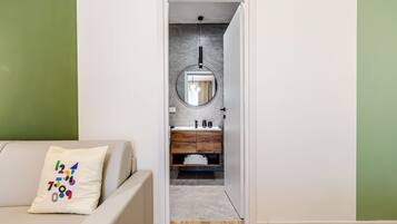 Family Quadruple Room, Private Bathroom | Minibar, in-room safe, desk, laptop workspace