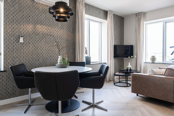 After exploring Nijmegen, unwind in this modern living space featuring a smart TV, soft lighting, and a comfortable lounge setup.