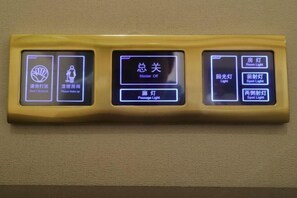 A control panel with multiple buttons for room lighting and other functions. - New Kwangsi Style Hotel (Guilin)