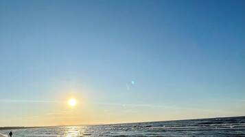 On the beach, sun loungers