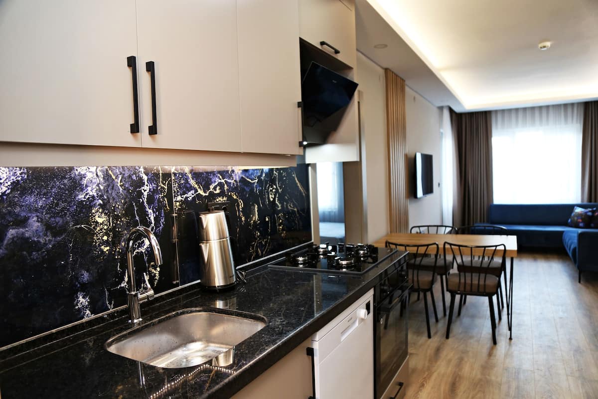 Suite, Balcony, Mountain View | Desk, laptop workspace, iron/ironing board (on request), WiFi (free)