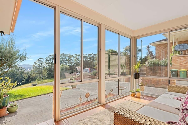A light-filled haven sunroom designed for relaxation and endless views.