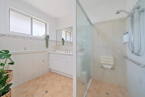 Shower, hair dryer, towels, shampoo