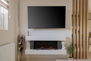 City Apartment | Living area | 55-inch Smart TV with digital channels - Athenian Stylish Apartment (Athens)