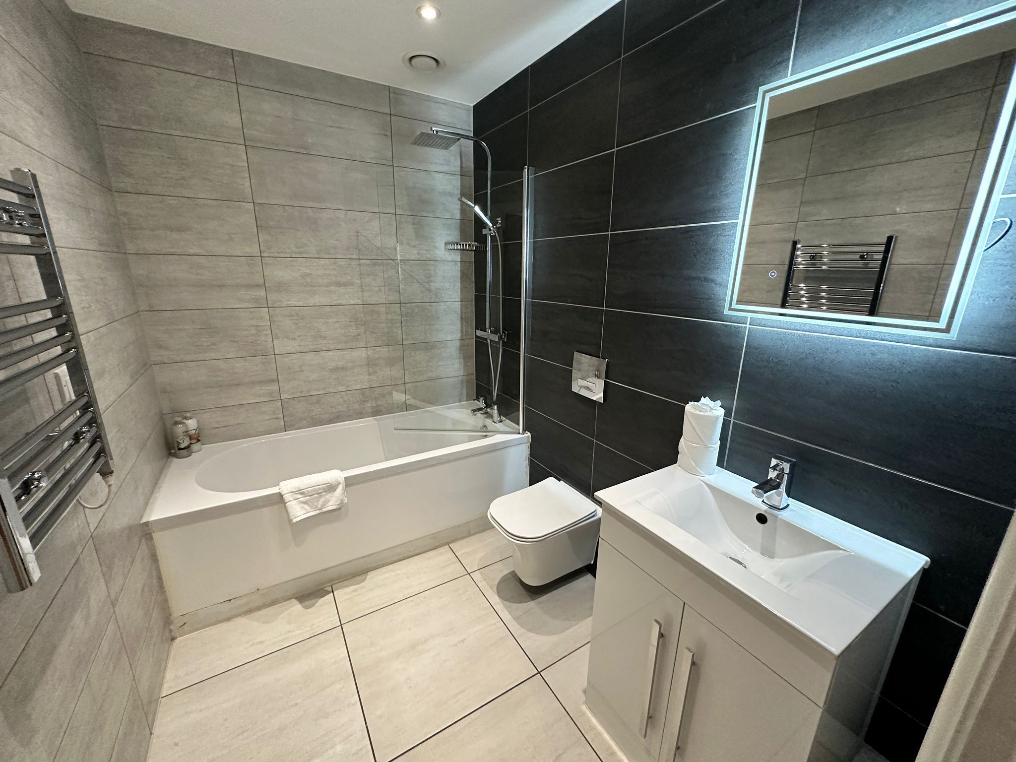 Combined shower/bathtub, hair dryer, towels, soap