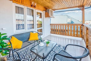 Tremannsrom, byutsikt | Terrasse/patio