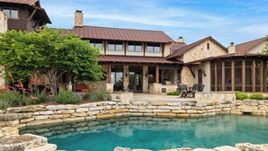 A stone pool surrounded by a stone wall, with a wooden deck and outdoor furniture. - Private Ranch - Pool, Ping Pong, Yoga, Weddings, Games (Bergheim)