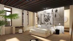 Une chambre moderne avec un grand lit, un bureau, une chaise et une plante en pot.