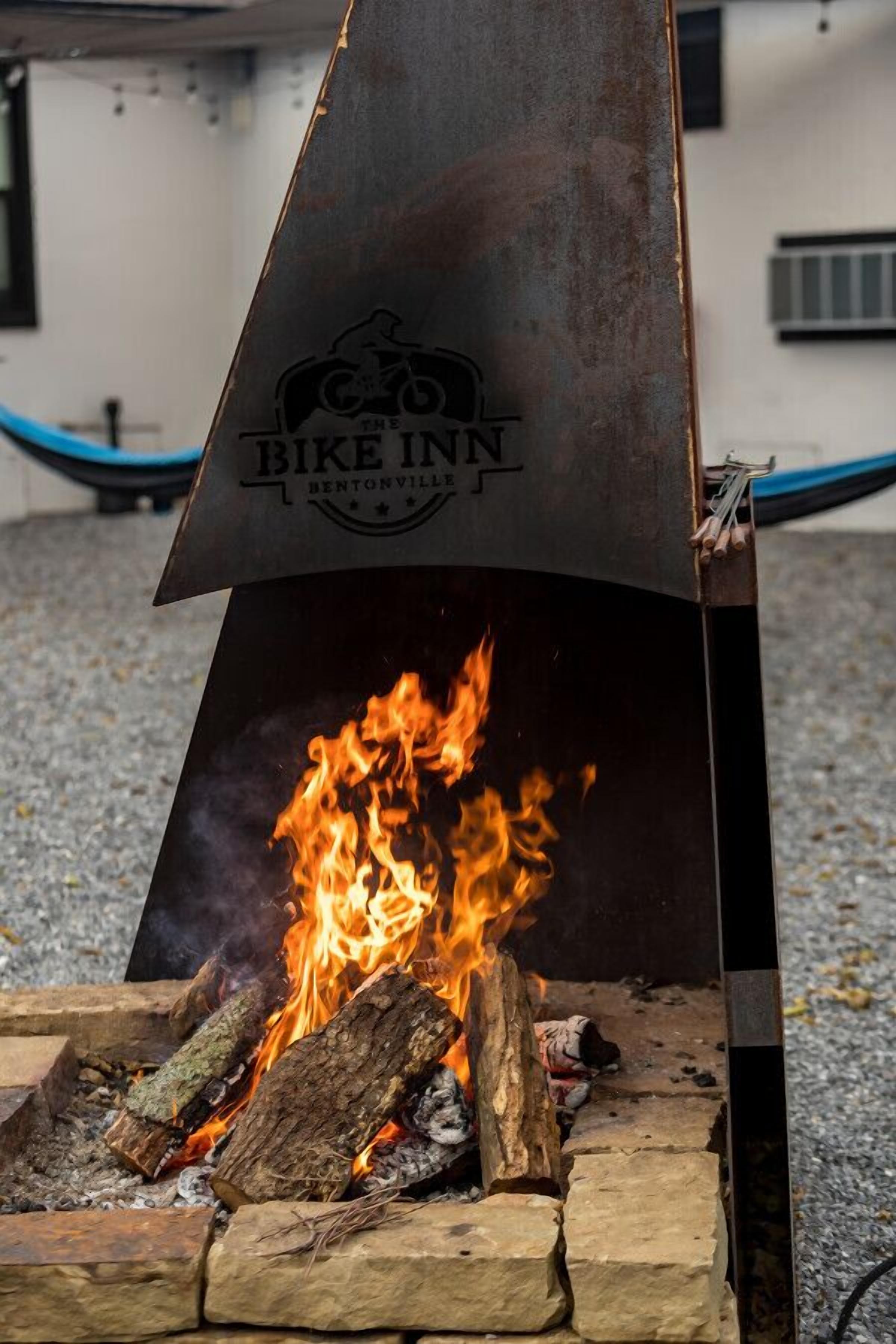 A metal grill with a logo and the text "BIKE INN" and "BENTONVILLE" on it.