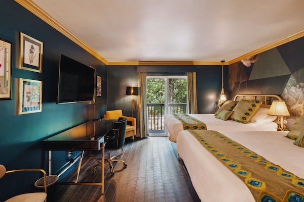 Classic Double Queen with Balcony | Blackout drapes, iron/ironing board, free WiFi, bed sheets