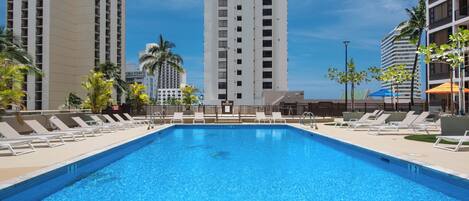 Outdoor pool, a heated pool, open 8:00 AM to 9:00 PM, pool loungers