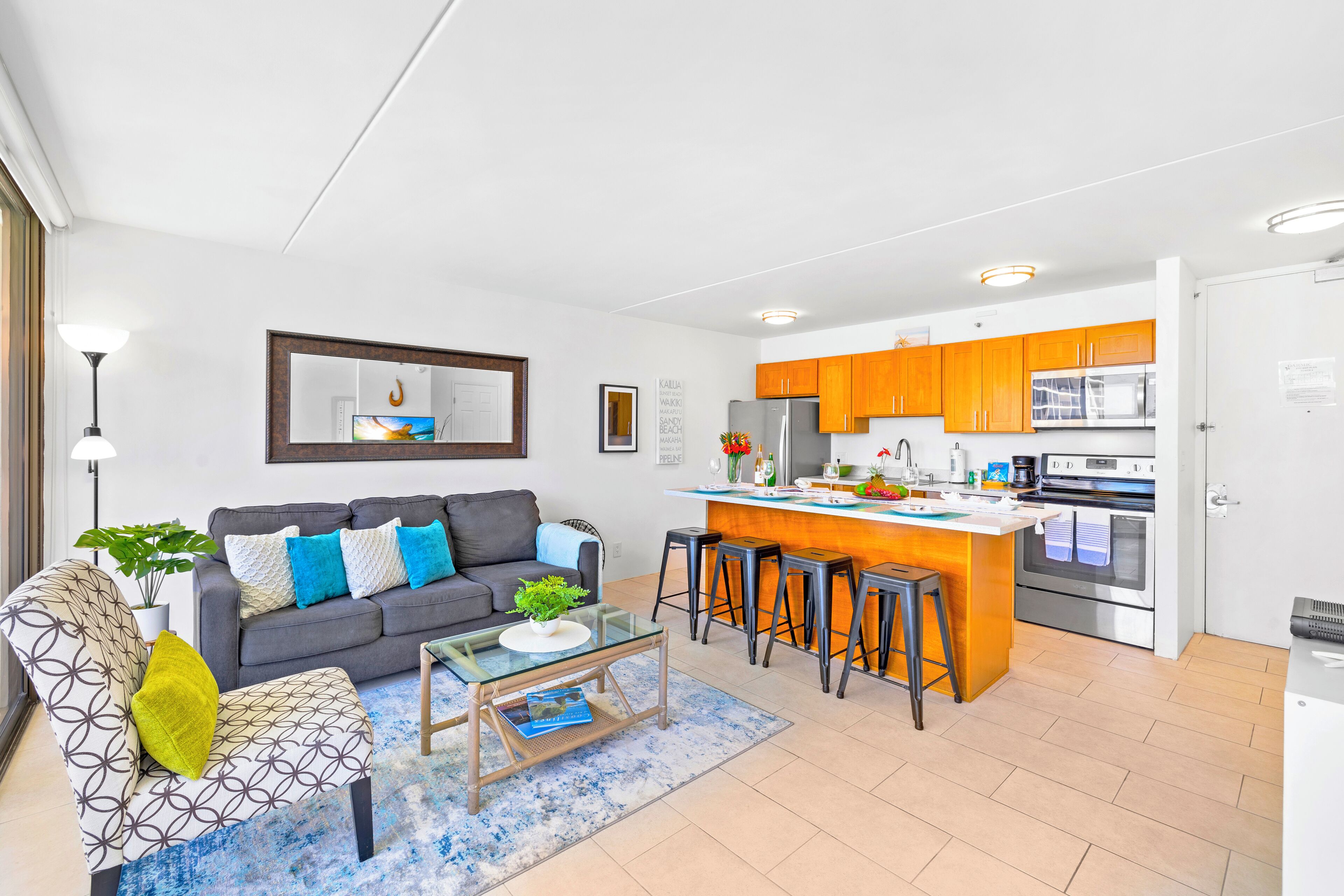 A modern apartment with a living room, kitchen, and dining area.