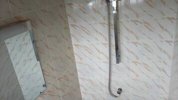 Shower, towels, soap, toilet paper