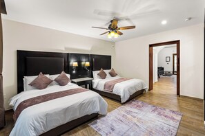 A hotel room with two beds, a ceiling fan, and a wooden floor. - Casa Cristal, Hotel Boutique (San Miguel de Allende)