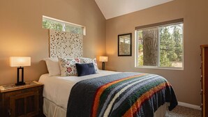 A bedroom with a bed, two bedside tables, a window, and a door. - Blissful Bay Cabin + Block from Boulder Bay (Big Bear Lake)