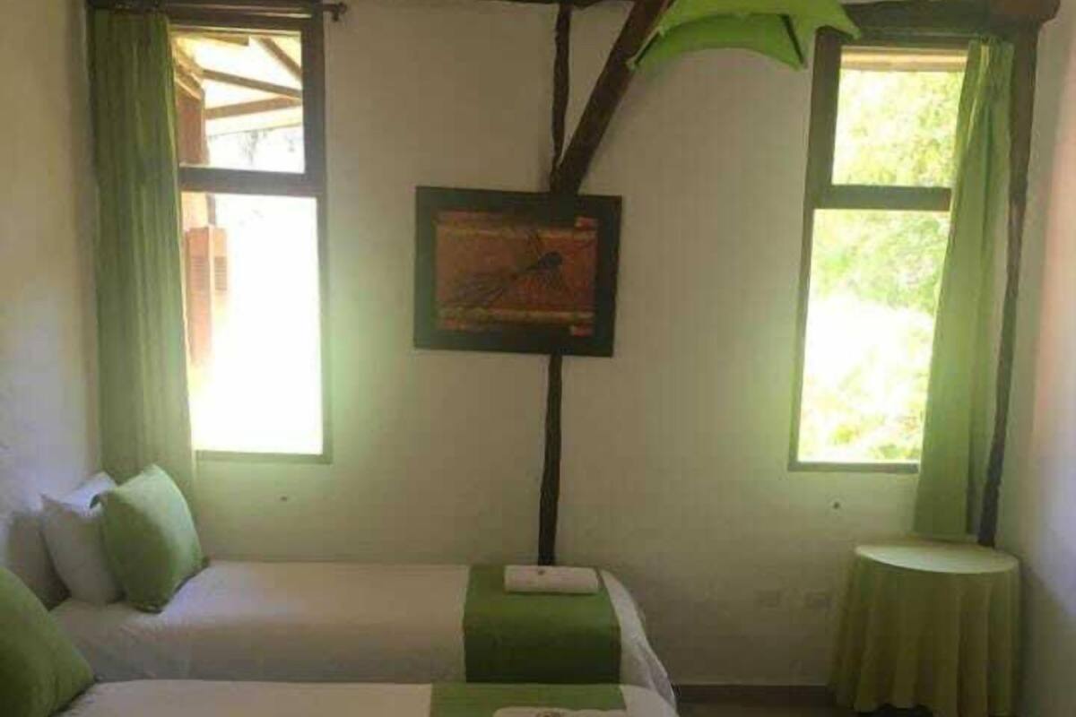 Triple Room, Pool View | In-room safe, free WiFi