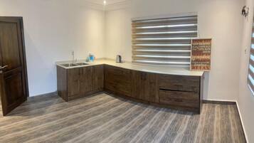 Deluxe Penthouse, City View | Private kitchen | Mini-fridge, microwave, oven