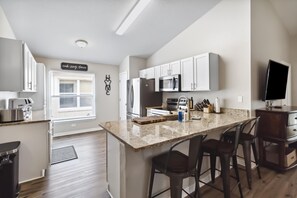 Fridge, microwave, oven, stovetop - 5/3 Pool home located in Reserve at Town Center Community! (Davenport)