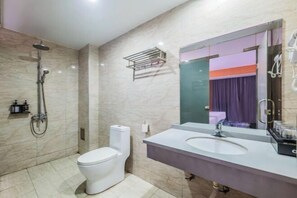 A modern bathroom with a toilet, sink, and shower. - Fuyang Youyou Express Hotel (High-speed Railway Station) (Shaoyang)