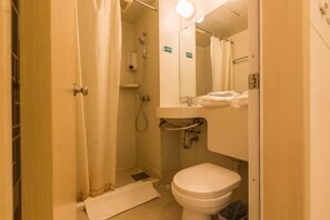 A compact bathroom with a toilet, sink, and shower. - Jinjiang Inn (Xi'an Jianguomen, Jiaotong University, Hepingmen Metro Station) (Xi'an)