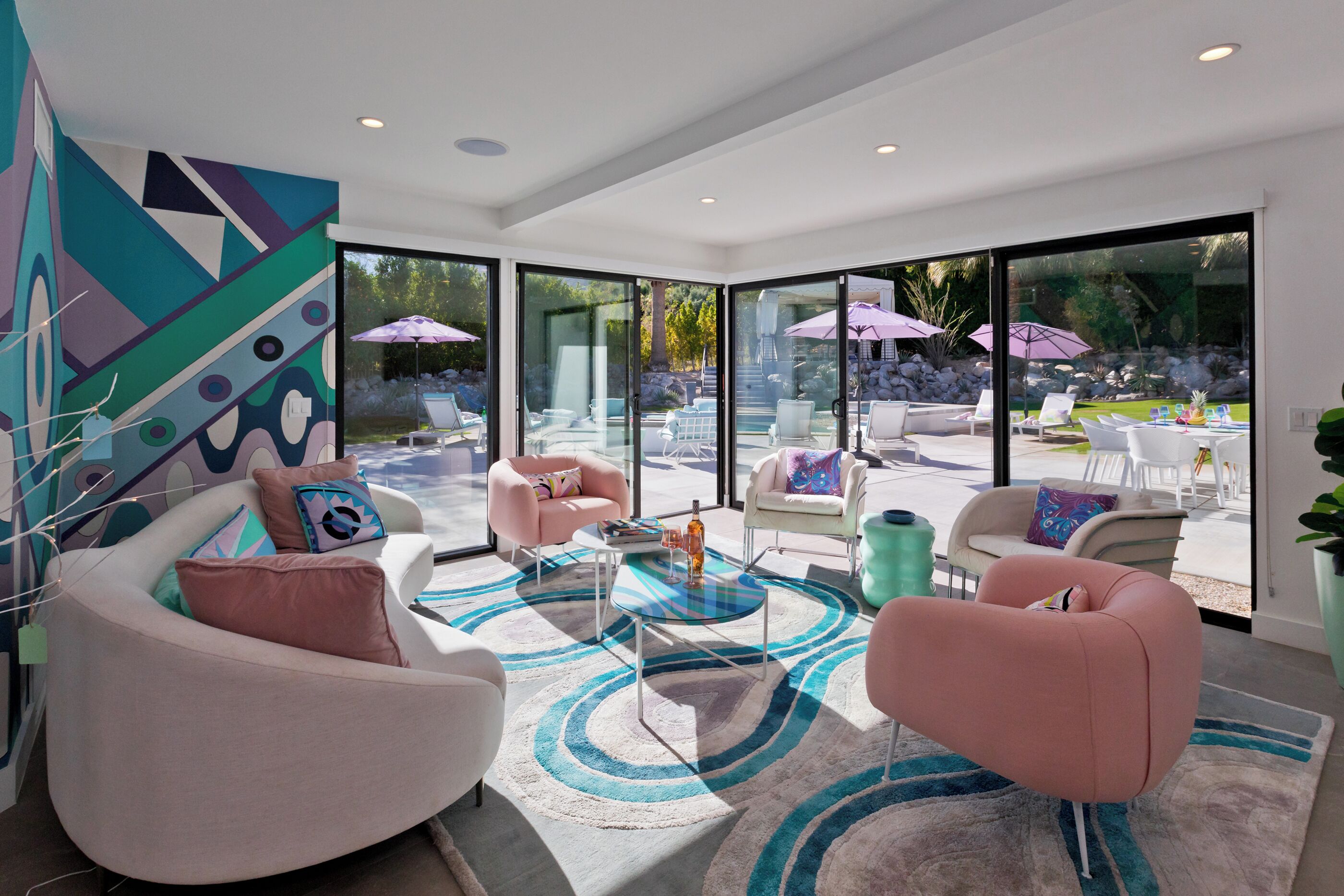 Living room with direct access to the pool deck. Large flat screen smart TV.
