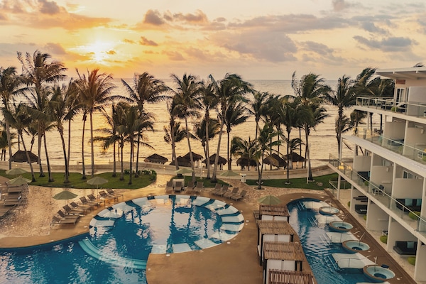 On the beach, white sand, beach umbrellas, beach towels