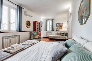 1 bedroom, desk, iron/ironing board, travel crib