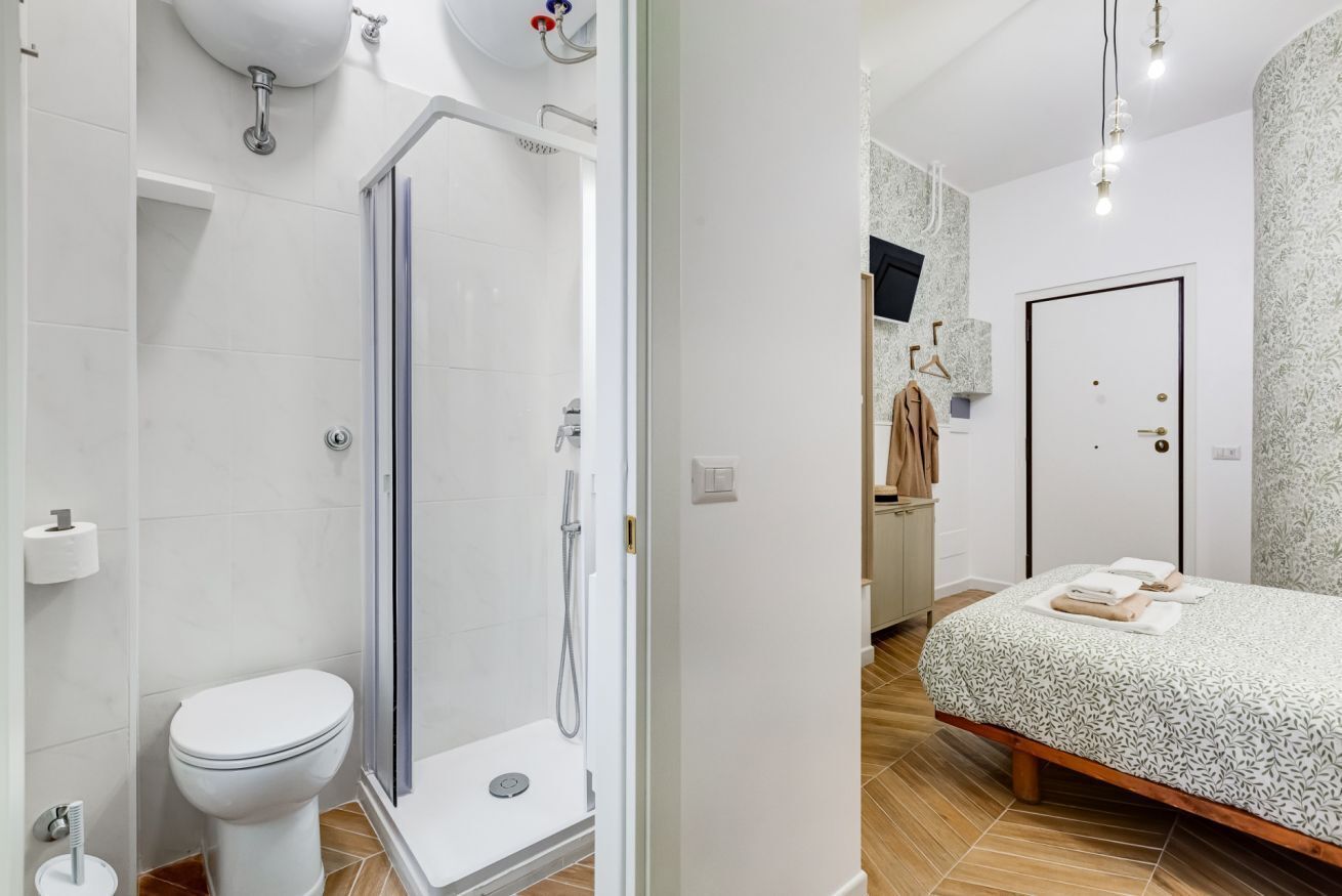 Shower, hair dryer, towels, shampoo