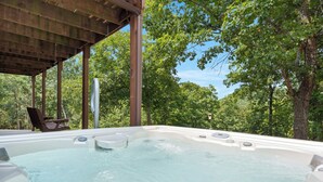 A hot tub under a wooden pergola surrounded by trees. - Private 4.5-Acre Retreat featuring Hot Tub-Firepit-Walk to Table Rock-Free Daily Attraction Tickets (Lampe)