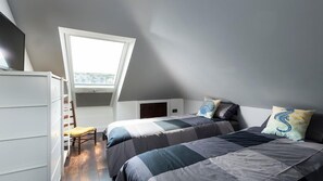 A bedroom with two beds, a window, and a white dresser. - HipNautic, Mevagissey, sleeps 6 (Mevagissey)