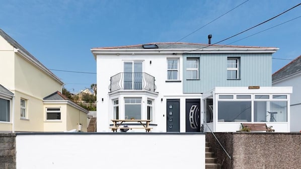 A two-story residential building with a bay window, a balcony, and a front door. - HipNautic, Mevagissey, sleeps 6 (Mevagissey)