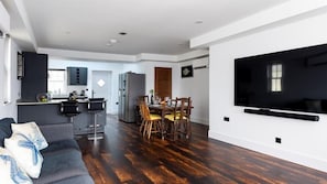 A modern apartment with a dining area, kitchen, and living space. - HipNautic, Mevagissey, sleeps 6 (Mevagissey)