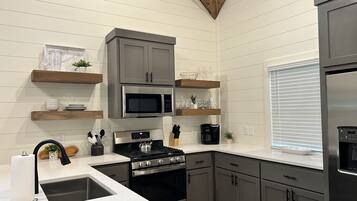 Coffee/tea maker, fridge, microwave, oven