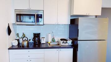 Fridge, microwave, stovetop, coffee/tea maker