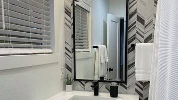 Hair dryer, towels, soap, shampoo