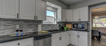 Modern home with pool, games, sauna, massage chair and huge lot!