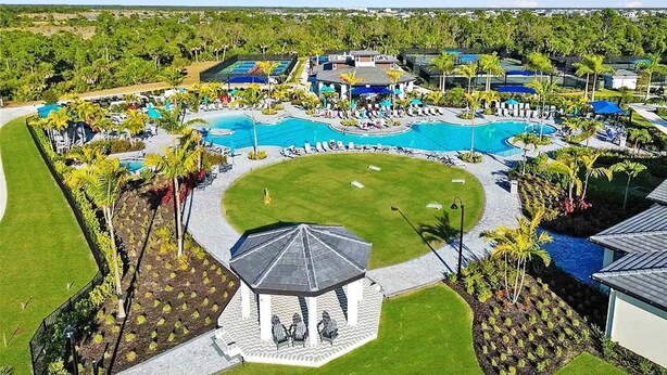 A resort with a large central pool, multiple smaller pools, and a gazebo.