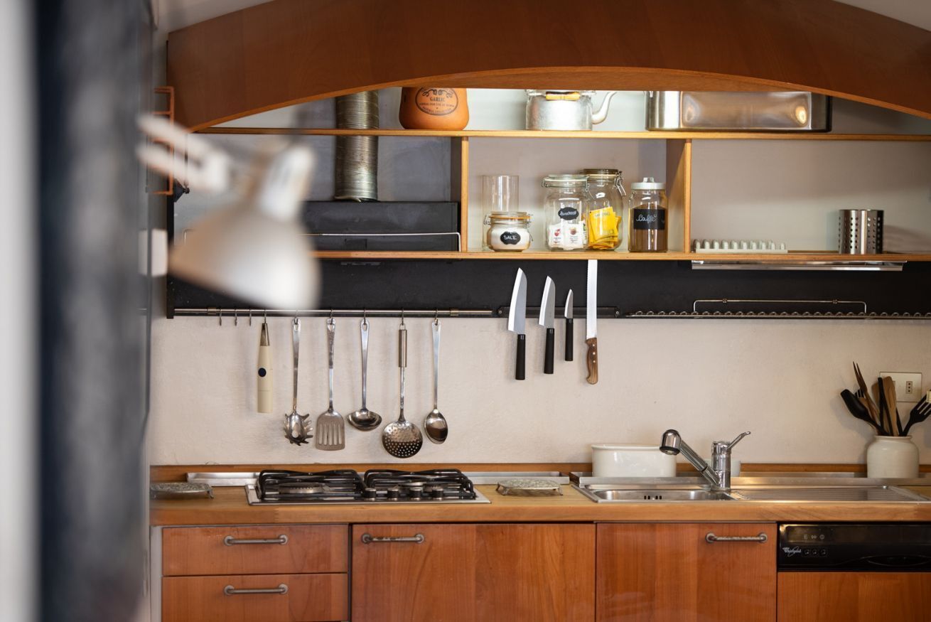Fridge, stovetop, dishwasher, coffee/tea maker