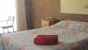 Economy Double or Twin Room | Desk, laptop workspace, blackout drapes, iron/ironing board