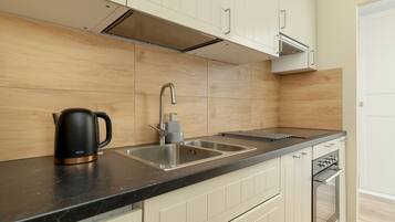 Dishwasher, coffee/tea maker, cookware/dishes/utensils