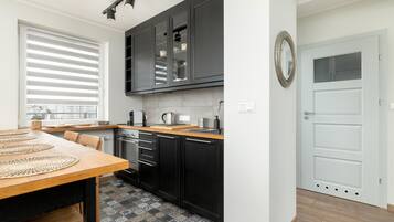 Dishwasher, coffee/tea maker, highchair, cookware/dishes/utensils