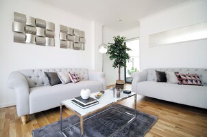 Deluxe Apartment, Balcony, City View | Living area | 39-inch flat-screen TV with digital channels, TV, Netflix