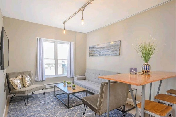 Bright living room with 55" smart TV.