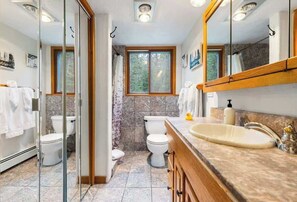 Shower, hair dryer, towels, shampoo
