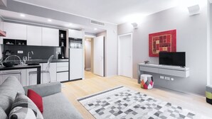 A modern apartment with a kitchen, living room, and dining area. - Easylife - Elegant flat at Castello Sforzesco (Milan)